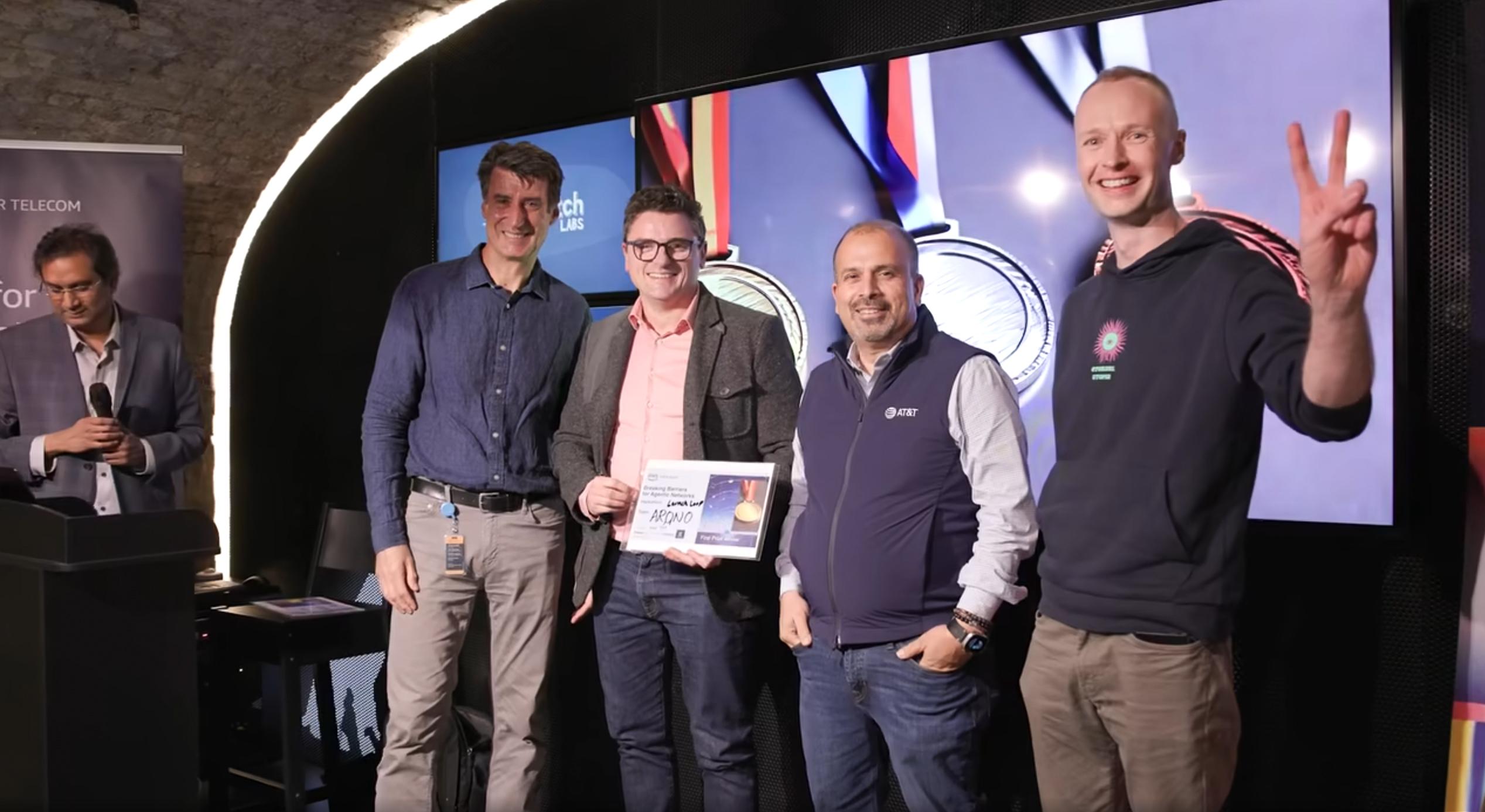 Team LaunchLoop receiving first place award at AWS Breaking Barriers Hackathon