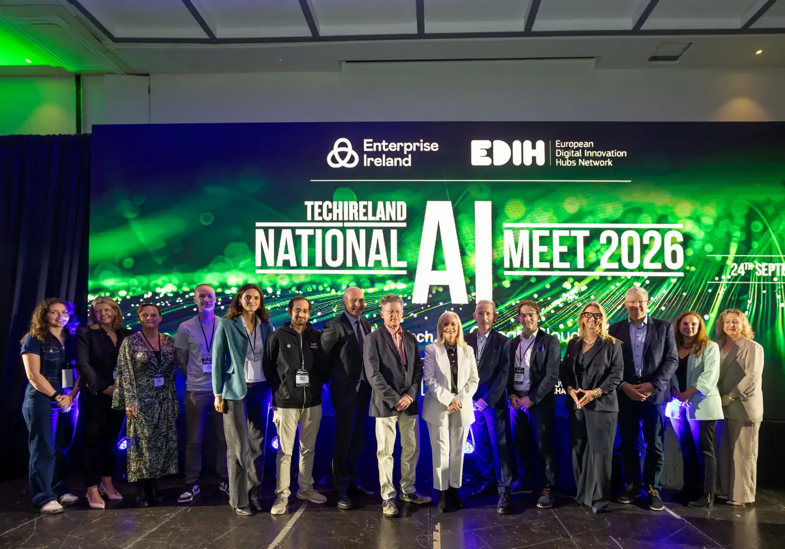 Speakers and guests lined up on stage at the TechIreland National AI Meet 2026 in front of the event backdrop